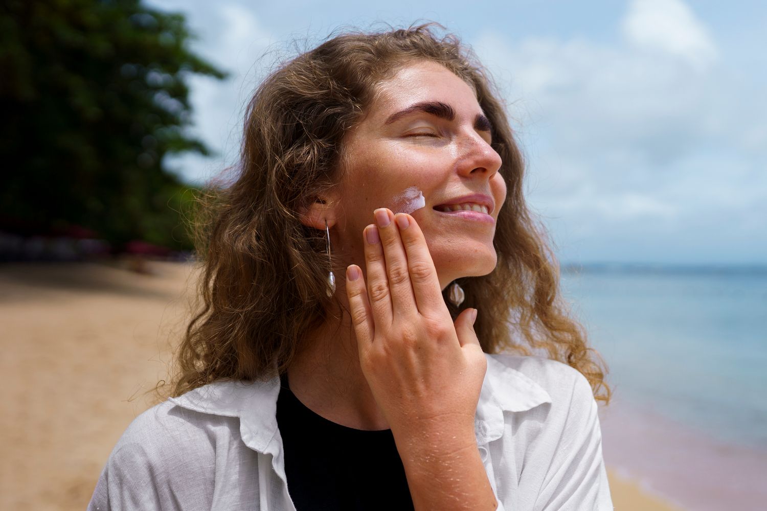 portrait-adult-woman-applying-lotion-sunburn-skin.jpg
